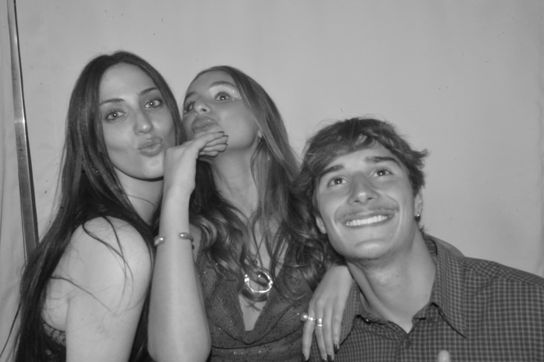 Party guests striking poses in photo booth Cape Town
